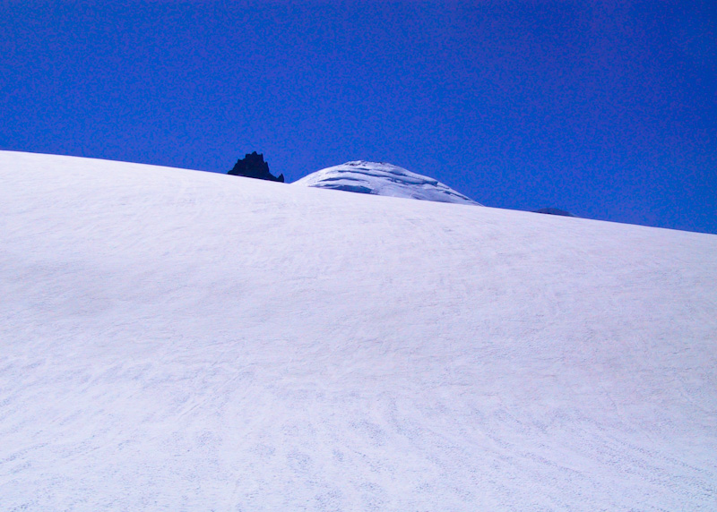 Summits Of Little Tahoma And Mount Rainier Above Snow Slope